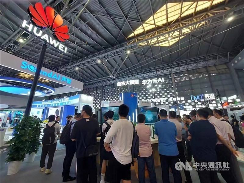 An undated photo shows visitors browsing items on display at a Huawei show booth. CNA file photo