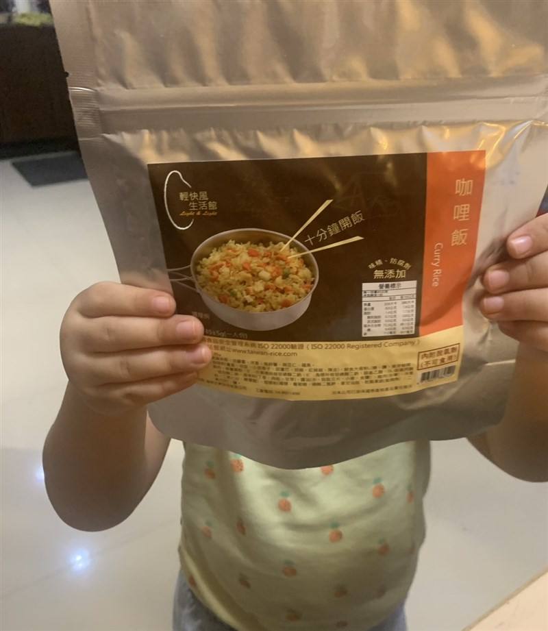 Amy Chang’s 2-year-old hides behind a pack of freeze-dried food, which she has been gradually introducing familiarize her child with it in case it becomes a staple during an emergency. Photo courtesy of Amy Chang July 4, 2025