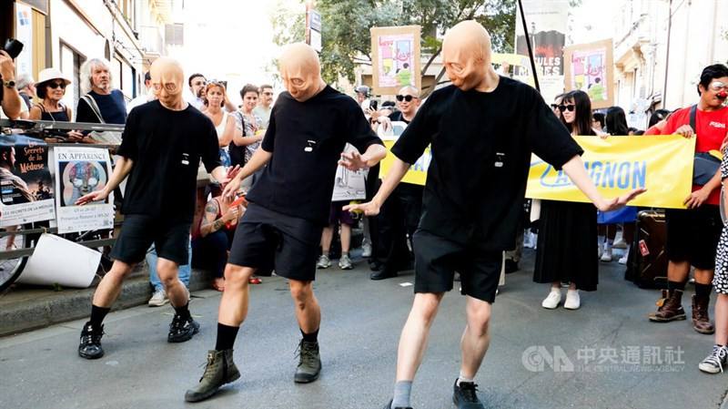 Taiwan's D_Antidote Production performs at the festival's opening parade on Saturday.