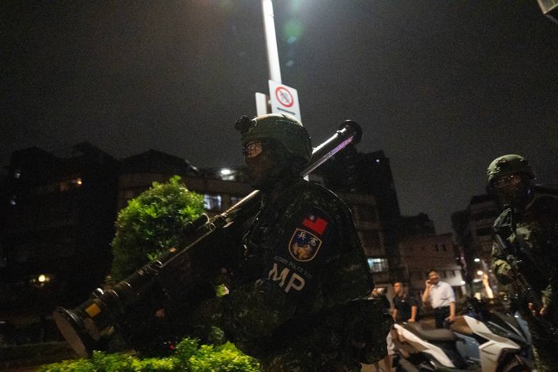 A Military Police officer carries a FIM-92 Stinger on his shoulder during the early-morning drills on Monday.