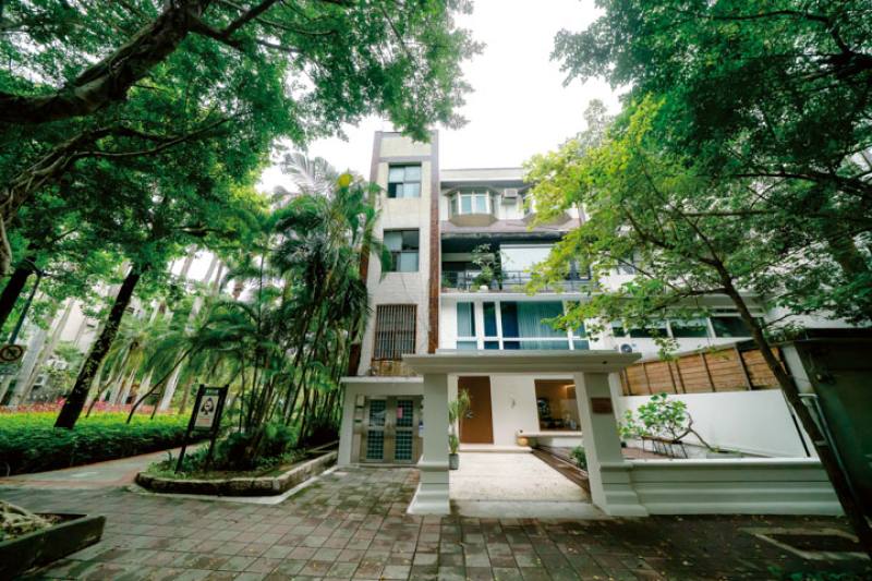 Rows of old walkup apartment buildings set amid greenery are a common sight in Taipei and other Taiwanese cities.