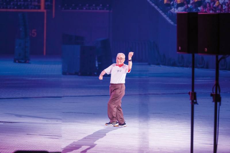 104-year-old Lin Yu-mao, the world’s oldest competitive badminton player, dances during the WMG 2025 opening ceremony.​​