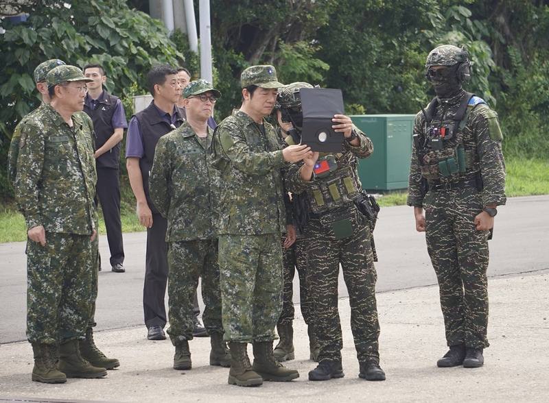 President Lai Ching-te (front, third right) listens to a briefing during Monday's drill in Kaohsiung. CNA photo July 14, 2025