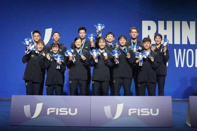 Members of Taiwan's mixed badminton team pose on the podium with their silver medal win. Photo courtesy of the Chinese Taipei University Sports Federation