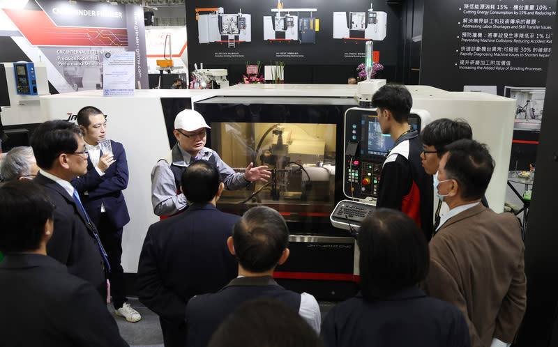 Visitors to the Taipei International Machine Tool Show listen to a product presentation on March 3, 2025.