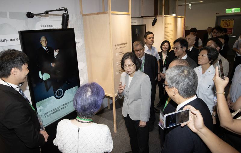 Former President Tsai Ing-wen (center) attends the "PROTOTYPE: Mr. Democracy 2.0" exhibition in New Taipei on Wednesday. CNA photo July 30, 2025