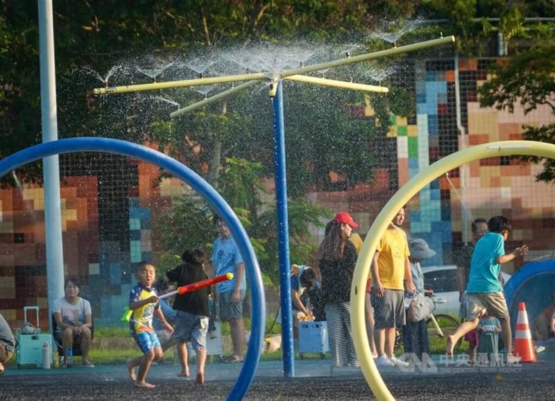 Kids splashing around in the park to cool off from the summer heat. CNA file photo