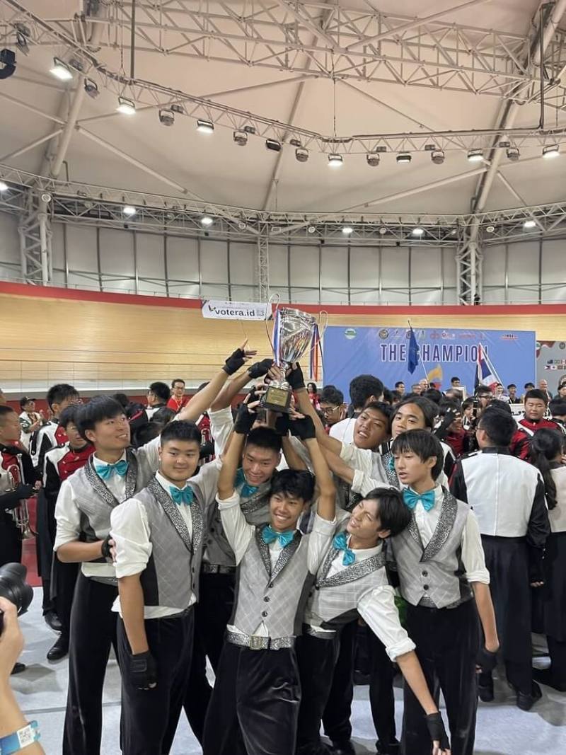 Members of the Taipei Municipal Chien Kuo High School Marching Band pose for a picture with their trophy. Photo courtesy of the Taipei Municipal Chien Kuo High School Marching Band Parent Fan Club Aug. 11, 2025