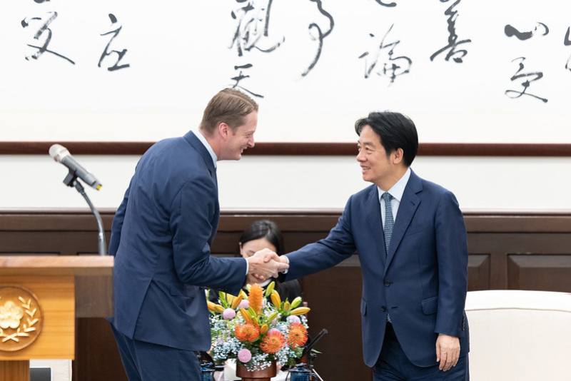 President Lai Ching-te shakes hands with John L. Thornton China Center Director Ryan Hass.