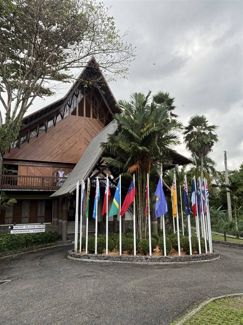 The flags of the Pacific Islands Forum member countries are arrayed at the entrance of the forum venue in the Solomon Islands. Image taken from the Pacific Islands Forum Facebook page