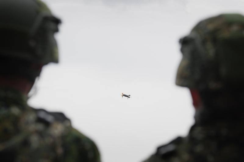 Two military personnel observe a drone in operation during the 2025 Han Kuang military exercises in this CNA file photo