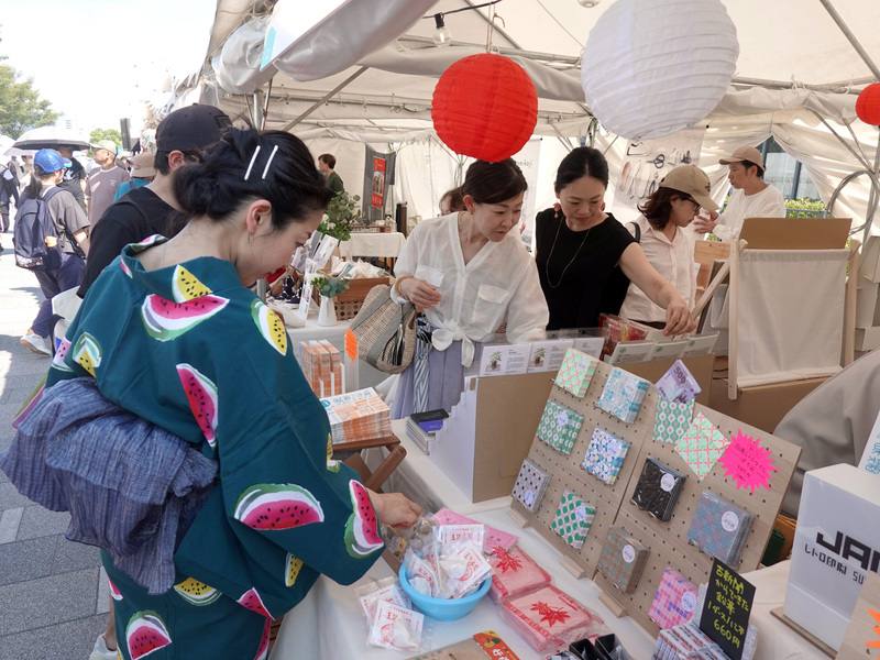 People visit a stand at Nakanoshima Park on Sunday. CNA photo Aug. 17, 2025