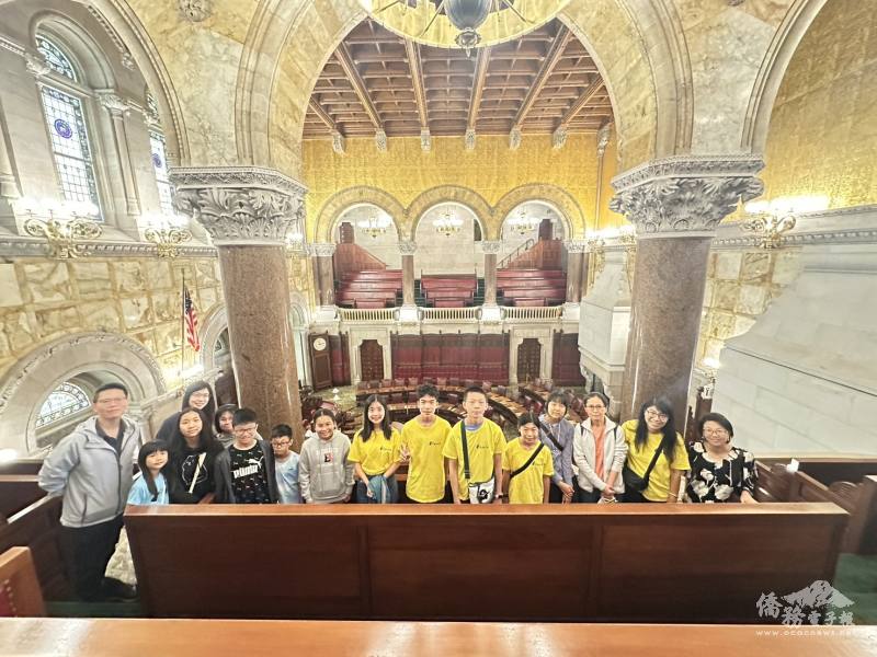 Albany FASCA members pose in the historic New York State Senate Chamber, surrounded by its ornate golden mosaics.