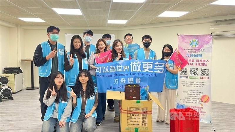Ark Volunteer Team founder Winny Wen (third right, second row) and members of her team smile for a photo before heading out on an outreach to distribute supplies to homeless people. Photo courtesy Sept. 20, 2025