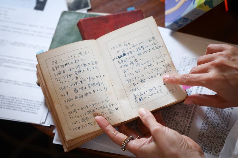 Tae Hitoto displays her father's belongings during the interview. CNA photo Sept. 20, 2025