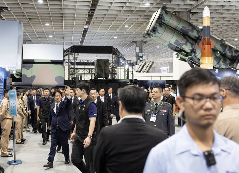 President Lai Ching-te (left, waving his hand) walks through the Chiang-Kong missile, its launcher, and its associated radar in Taipei on Friday. CNA photo Sept. 19, 2025