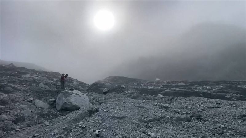 A member of a survey team to Hualien County's Matai'an Creek barrier lake takes photos of the devastating scene of the location. Photo courtesy of the Hualien branch of Taiwan's Forestry and Nature Conservation Agency