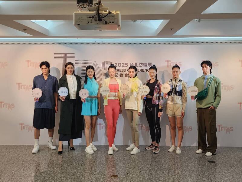 Models pose in outfits produced by textile companies during an event ahead of the 2025 Taipei Innovative Textile Application Show (TITAS) on Monday. CNA photo Oct. 6, 2025