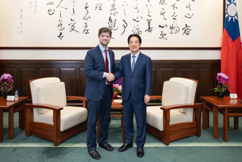 President shakes hands with Buck Sexton, a host of the American radio program The Clay Travis and Buck Sexton Show.