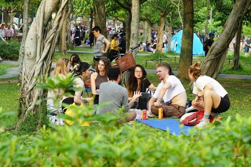People of various ethnic backgrounds have a picnic at a park in this undated picture. Photo courtesy of the Tourism Innovation Association of Taiwan Oct. 19, 2025