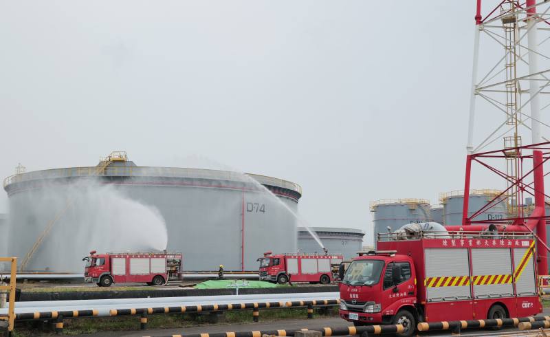 Fire brigade personnel from CPC's Dalin Refinery conduct a protective cooling drill using a fire monitor.