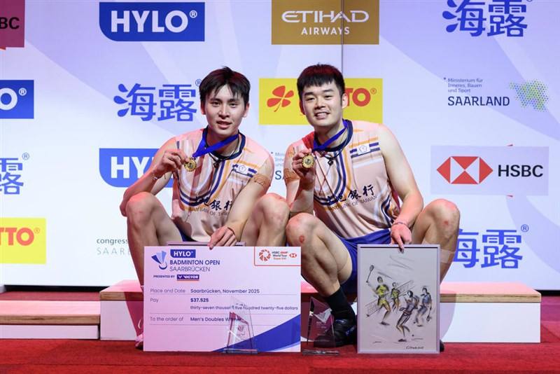 Wang Chi-lin (right) and Chiu Hsiang-chieh pose with their medals after winning the men’s doubles title at the 2025 Hylo Open in Germany on Sunday. Photo courtesy of Badminton Photo