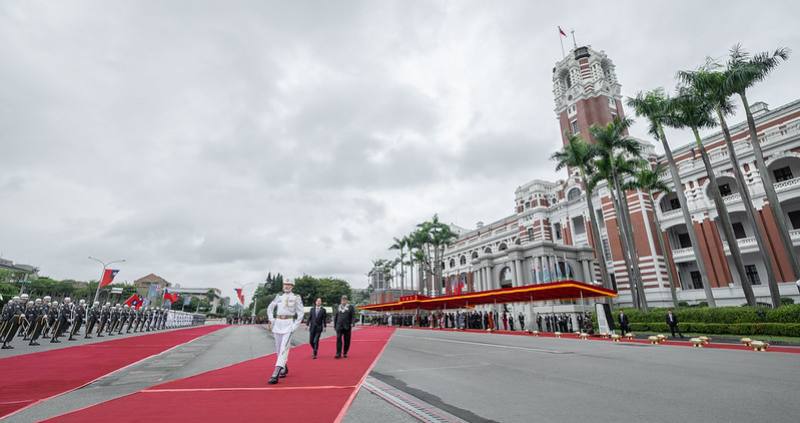 President Lai and Prime Minister Feleti Teo of Tuvalu review the military honor guard.