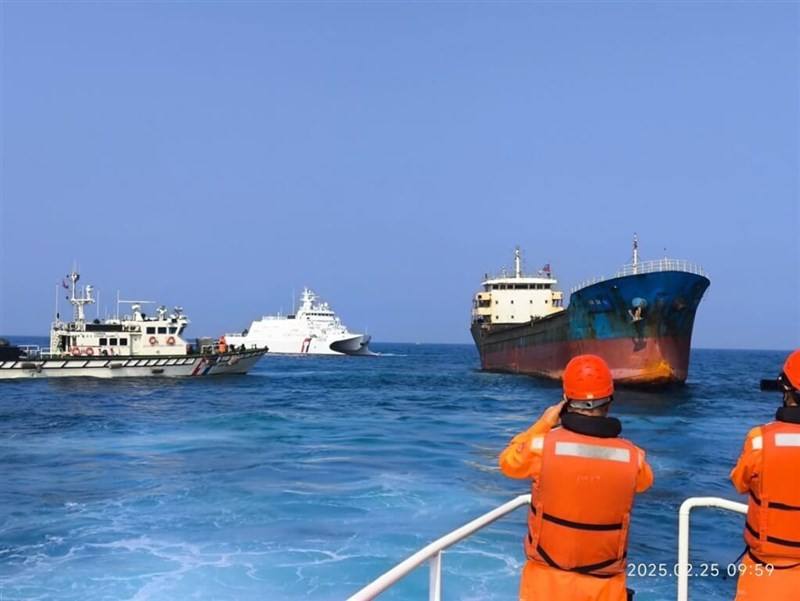 Taiwan's coast guard officers prepare to board a Togolese-registered vessel on suspicion of its involvement in rupturing an undersea cable in February this year. File photo courtesy of the Coast Guard Administration