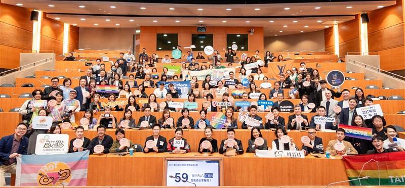 Representatives of the 59 companies and organizations that are recognized as “LGBTIQ+ inclusive workplaces” smile for a group photo during an event in Taipei on Tuesday. Photo courtesy of Taiwan Equality Campaign Dec. 9, 2025