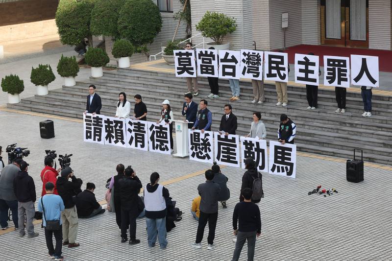 Members of the TPP voice their critique in the form of a small demonstration on Monday. CNA photo Dec. 15, 2025