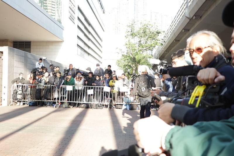 Domestic and international press gather outside the Hong Kong High Court to wait on the update for Hong Kong media tycoon Jimmy Lai. CNA photo Dec. 15, 2025