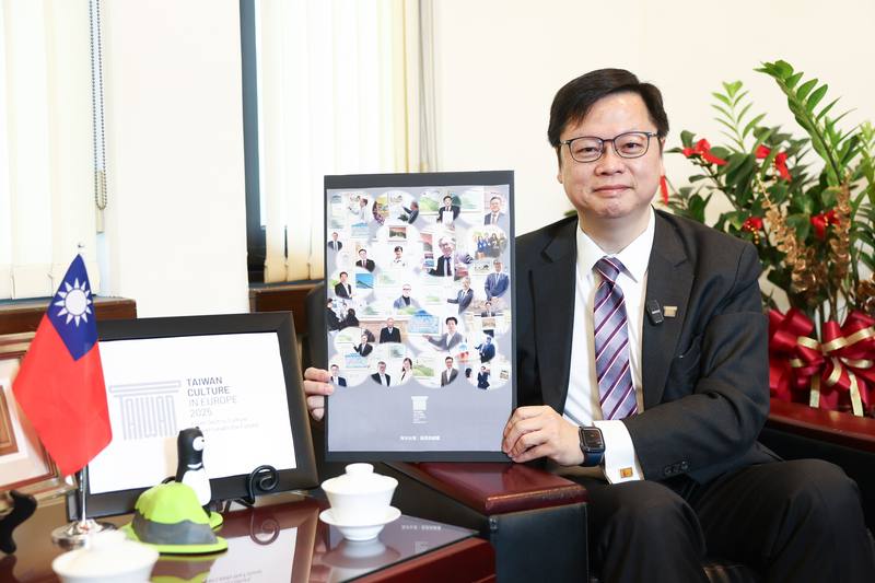 Eric Huang, head of the Ministry of Foreign Affairs’ Department of European Affairs, poses with a poster for the “Ocean Taiwan: Landscapes and Paintings” exhibition -- part of the "Taiwan Culture in Europe 2025" initiative -- during an interview with CNA 