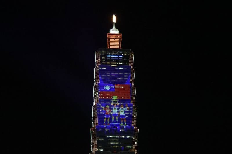 Taipei 101 showcased its “Taiwan’s Invisible Heroes” light projection show at a press event on Tuesday. CNA photo Dec. 23, 2025