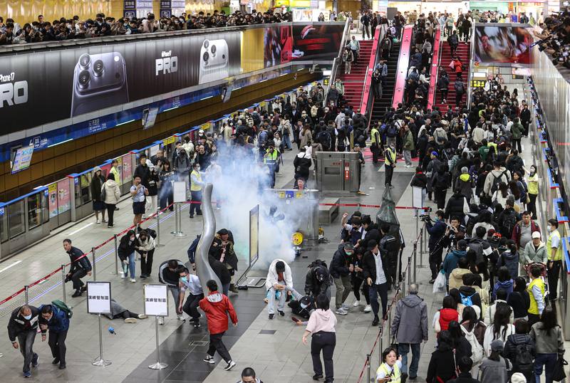 Police and emergency responders conduct a drill at MRT Taipei City Hall Station on Friday afternoon, simulating a gasoline-bomb attack and an indiscriminate assault. CNA photo Dec. 26, 2025