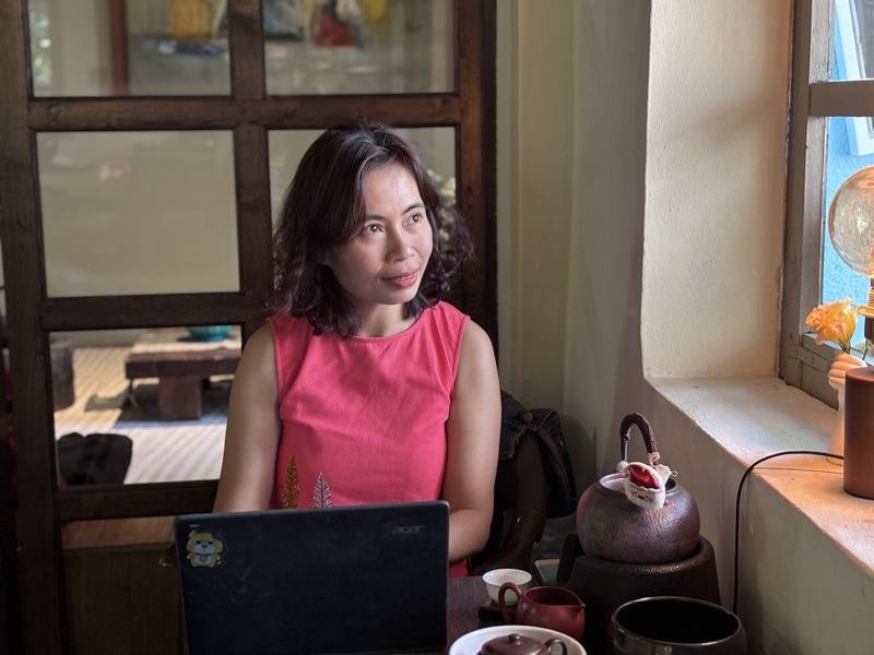 Vietnamese writer Nguyễn Thị Hoa, known by her pen name Trang Hạ, poses for a photo during a recent interview with CNA in Hanoi, Vietnam. CNA photo Dec. 27, 2025