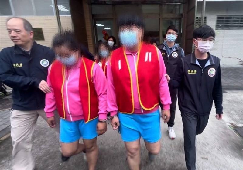 Three people connected to the illegal labor ring case being taken by NIA officials. Photo courtesy of the NIA