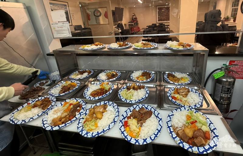Freshly prepared braised pork and chicken with rice and vegetables ready for service, providing warmth and nourishment to more than 100 guests at Homeless Solutions.