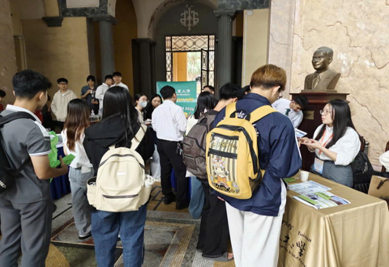 Students at different booths asking university representatives about applying for the INTENSE Program