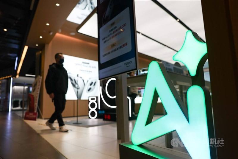 A consumer enters an electronics store that carries AI supported products in this CNA file photo