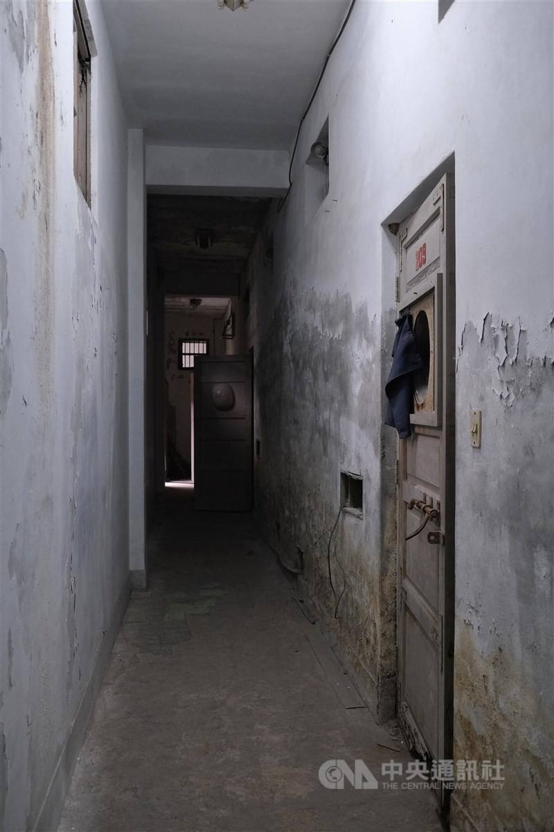 A narrow corridor lined with detention cells. CNA photo Feb. 12, 2026