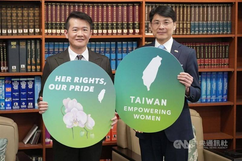 Deputy chief of the Ministry of Foreign Affairs' (MOFA) Department of NGO International Affairs Kang Chia-chi (left) and MOFA spokesperson Hsiao Kuangwei showcase the key visual for this year's Taiwan Gender Equality Week on Tuesday. CNA photo March 3, 20
