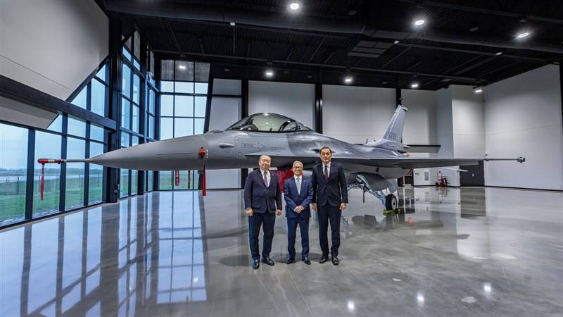 Taiwan's Representative to the United States Alexander Yui (left), Vice Defense Minister Hsu Szu-chien (center), and Air Force Deputy Chief of Staff Tien Chung-yi pose for a photo with the first of 66 F-16V fighter jets purchased by Taiwan from the U.S. i