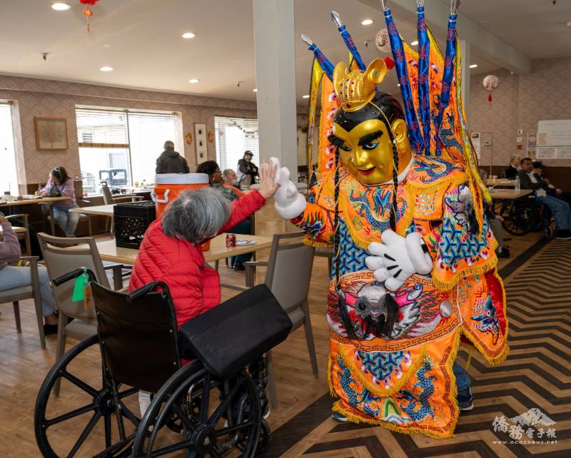 San Tai Zi performers interact with seniors, sharing smiles, high-fives, and joyful moments
during the celebration.