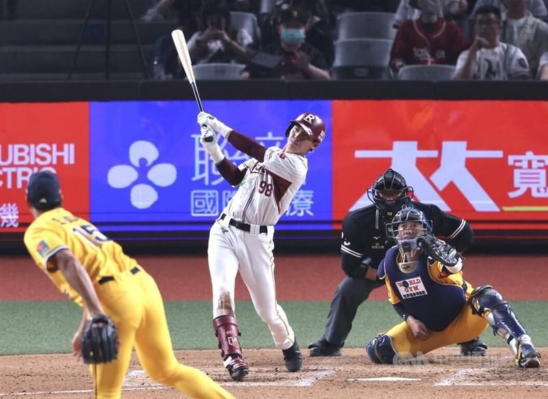Rakuten Monkeys batter Chen Chen-wei hits a solo home run during the 2026 season opener of Taiwan's Chinese Professional Baseball League at the Taipei Dome on Saturday. CNA photo