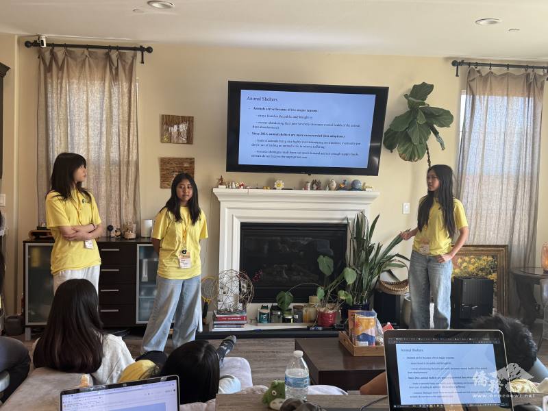 Project leaders Katie Ger, Zixi Shen, and Anya Lin (left to right) give a presentation to inform members of the importance of this event and instructions to craft the toys.