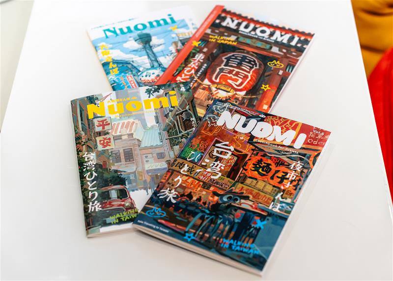 設計得有如雜誌一般的筆記本封面，是賣得相當好的產品。（林旻萱攝）。These popular notebooks designed by Nuomi look like magazines. (photo by Lin Min-hsuan)​​