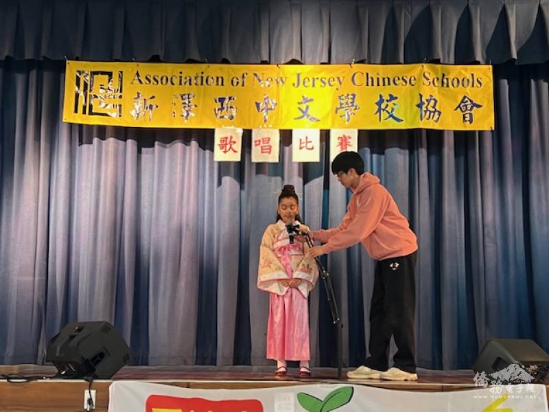 FASCA adjusting the microphone stands for contestants