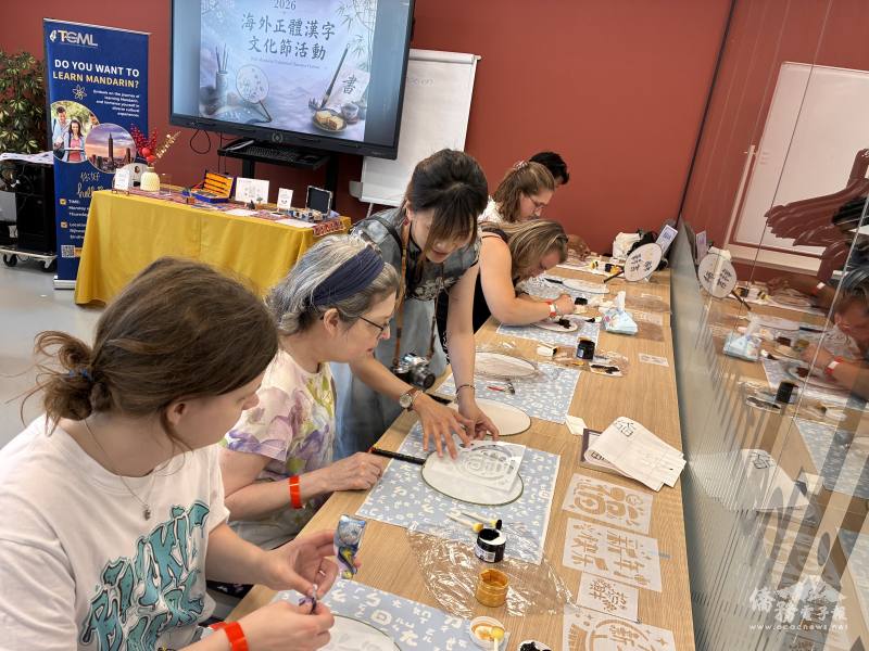 Participants design and decorate their own hand fans.