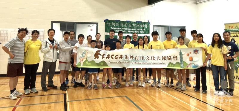 A group photo of the FASCA and TAA members volunteering or participating in the badminton tournament.