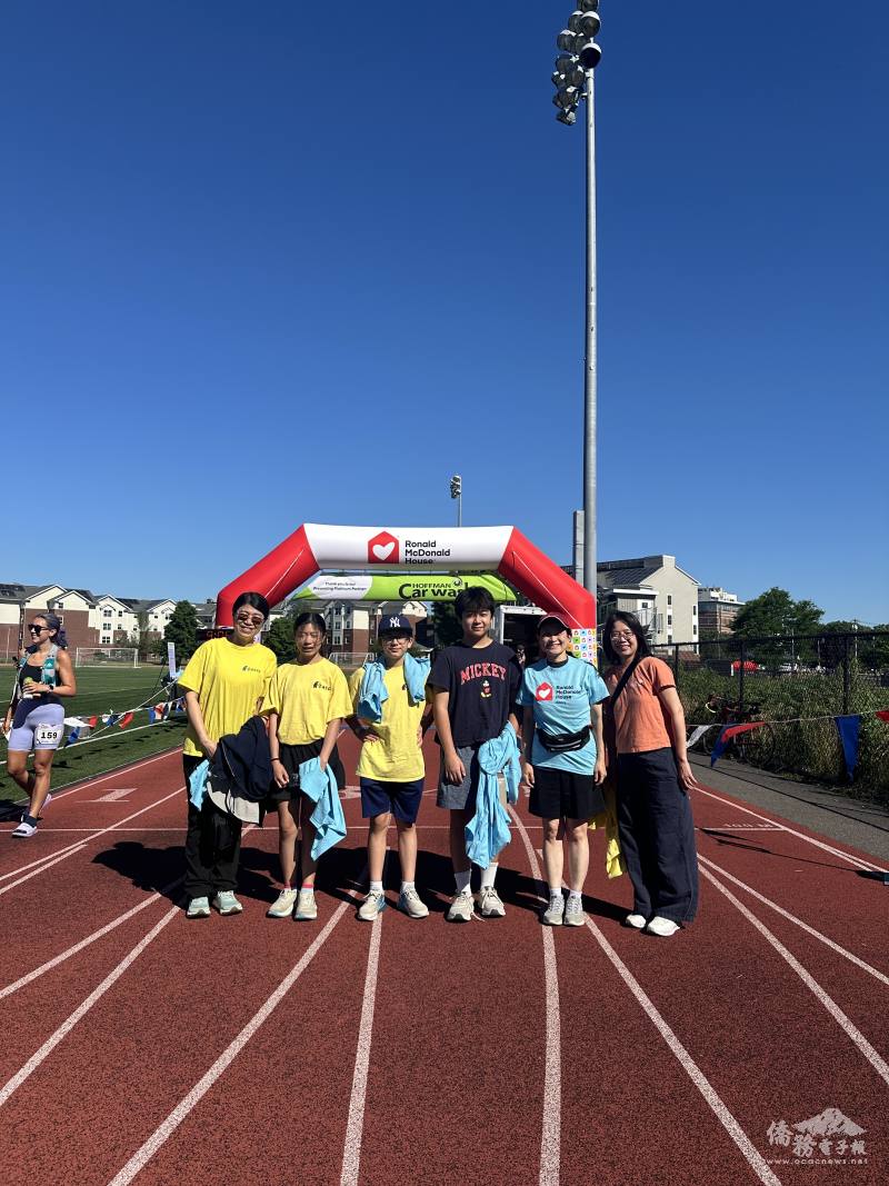 Participants and volunteers celebrate a successful day of community service at the finish line.